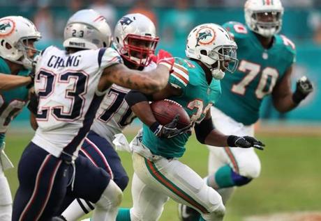 Miami Gardens, FL 12-9-18: Miami running back Kenyan Drake is pictured as he heads for the endzone where he scored the game winning touchdown on the last play of the game. Miami stunned New England 34-33. The New England Patriots visited the Miami Dolphins in a regular season NFL football game at Hard Rock Stadium. (Jim Davis/Globe Staff)
