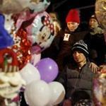 Edgar Mejia was consoled by his sister during a vigil for his two daughters Thursday night in Revere.