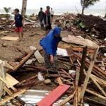 Residents in Carita Beach, Indonesia, inspected the damage to their homes after the tsunami.