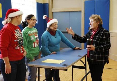 Dorchester, MA - 12/24/2018- ] Angela Menino talks with volunteers during a toy drive in Dorchester on Christmas Eve. The late Mayor Thomas M. Menino started this tradition 25 years ago and it is carried on by his wife Angela and his children, Susan and Tommy and their children. (Michael Swensen for The Boston Globe) Topic: (Metro) 
