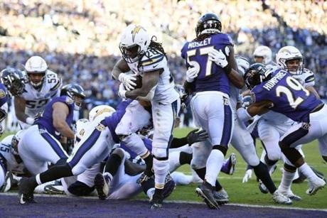 Los Angeles Chargers running back Melvin Gordon (28) scores a touchdown in the second half of an NFL wild card playoff football game against the Baltimore Ravens, Sunday, Jan. 6, 2019, in Baltimore. (AP Photo/Nick Wass)
