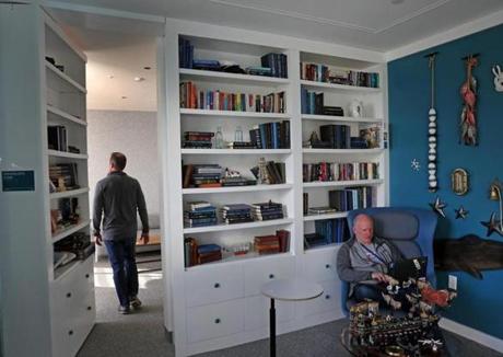 CAMBRIDGE, MA - 1/07/2019: Facebook's library with a bookcase wall that opens into a private or quiet room in the Cambridge site. Facebook preparing to open a large office in Kendall Square with space for hundreds of additional workers. (David L Ryan/Globe Staff ) SECTION: BUSINESS TOPIC 09facebook
