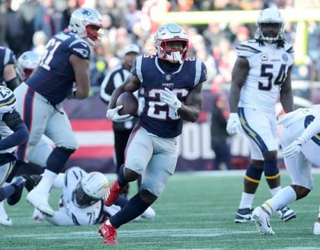 Foxborough, MA 01/13/19- Patriots Sony Michel runs for a 30-yards gain in the second quarter. The New England Patriots play against the Los Angeles Chargers in the AFC divisional playoff game at Gillette Stadium Sunday, Jan. 13, 2019.(Matthew J. Lee/Globe Staff)
