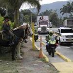 Two semi-trailer trucks containing humanitarian aid from the US for Venezuela were escorted by police in Los Patios, near Cucuta, Colombia, on Thursday.