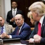 A federal judge said Commerce Secretary Wilbur Ross (center) broke a ??veritable smorgasbord?? of federal rules by overriding the advice of career officials.