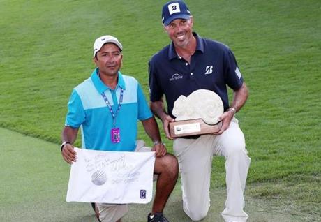 Matt Kuchar (right) with local caddie David Giral Ortiz, who agreed to payment terms before the tournament in Mexico in November.
