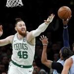 Boston Celtics' Aron Baynes goes to block a shot against the Memphis Grizzlies during the second quarter of an NBA basketball game Friday, Jan. 18, 2019, in Boston. (AP Photo/Winslow Townson)