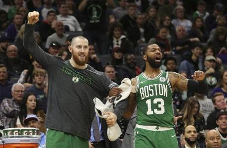Boston Celtics' Aron Baynes, left, and Marcus Morris dcelebrate after the Celtics scored during the second half of an NBA basketball game against the Sacramento Kings, Wednesday, March 6, 2019, in Sacramento, Calif. The Celtics won 111-109. (AP Photo/Rich Pedroncelli)

