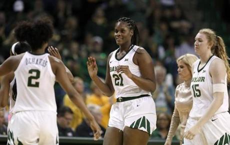 Baylor's DiDi Richards (2), Kalani Brown (21) and Lauren Cox celebrate as they walk to the bench during an NCAA college basketball game against Texas in Waco, Texas, Monday, Feb. 25, 2019. (AP Photo/Tony Gutierrez)
