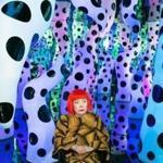 Yayoi Kusama pictured with her work LOVE IS CALLING, 2013 during her solo exhibition I Who Have Arrived In Heaven at David Zwirner, New York, 2013. © YAYOI KUSAMA. Courtesy David Zwirner, New York; Ota Fine Arts, Tokyo/Singapore/Shanghai; Victoria Miro, London/Venice