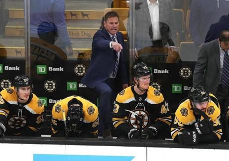 Boston-04/19/2019 The Boston Bruins vs Toronoto Maple Leafs game 5- The frustration shows on the Bruins bench with less than a minute left in the game, as coach Bruce Cassidy screams instructions to players on the ice, as he stands behind (left to rt) Noel Acciari, Sean Kuraly and Danton Heinen and Marcus Johansson. Photo by John Tlumacki/Globe Staff(sports)
