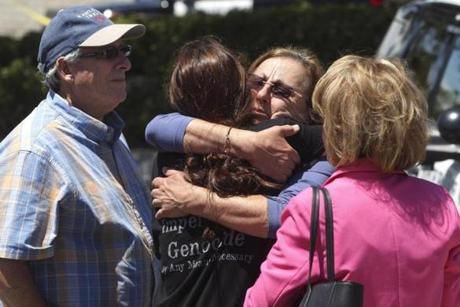 Members of a Poway, Calif., synagogue consoled one another after a shooting there on Saturday.

