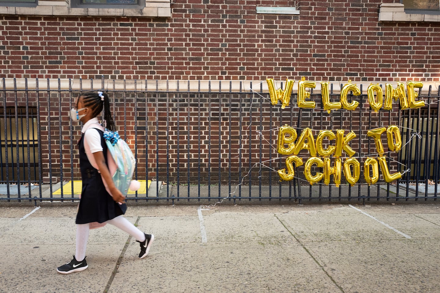 A girl headed to her elementary school in Brooklyn, New York on the first day of classes in 2021. This year, most schools are treating COVID like the flu or RSV, at the recommendation of the Centers for Disease Control and Prevention.