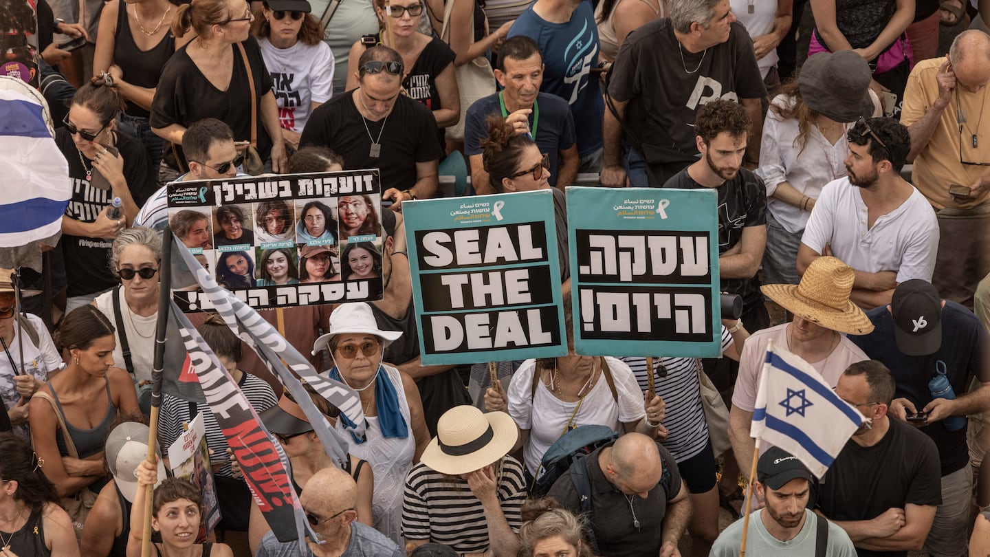 Demonstrators blocked a road during a protest calling for a deal for the release of hostages held in Gaza in Tel Aviv, Israel, on Monday. Thousands of workers walked off the job Monday in outrage over the deaths of hostages in Gaza, as protesters demanded that Israel reach a deal with Hamas.