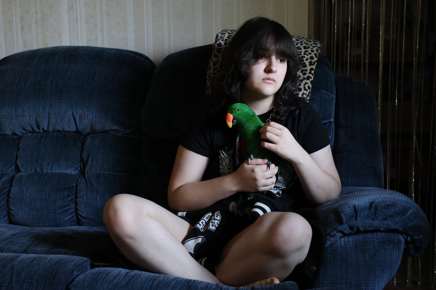 Samantha Frechon sat with her bird, Kiwi, on the couch inside the living room of her home. Samantha, who didn't attend school at all last year and was supposed to start high school after Labor Day, still doesn't have a school to attend.