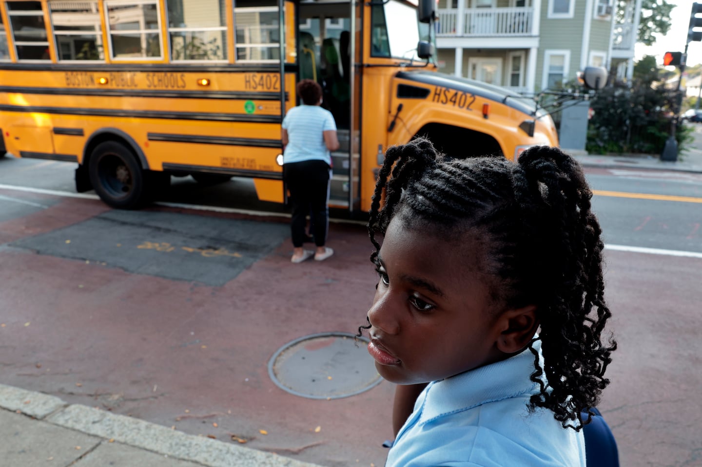 A Conley Elementary School second-grader waited for her bus in Boston, on Sept. 7, 2023.