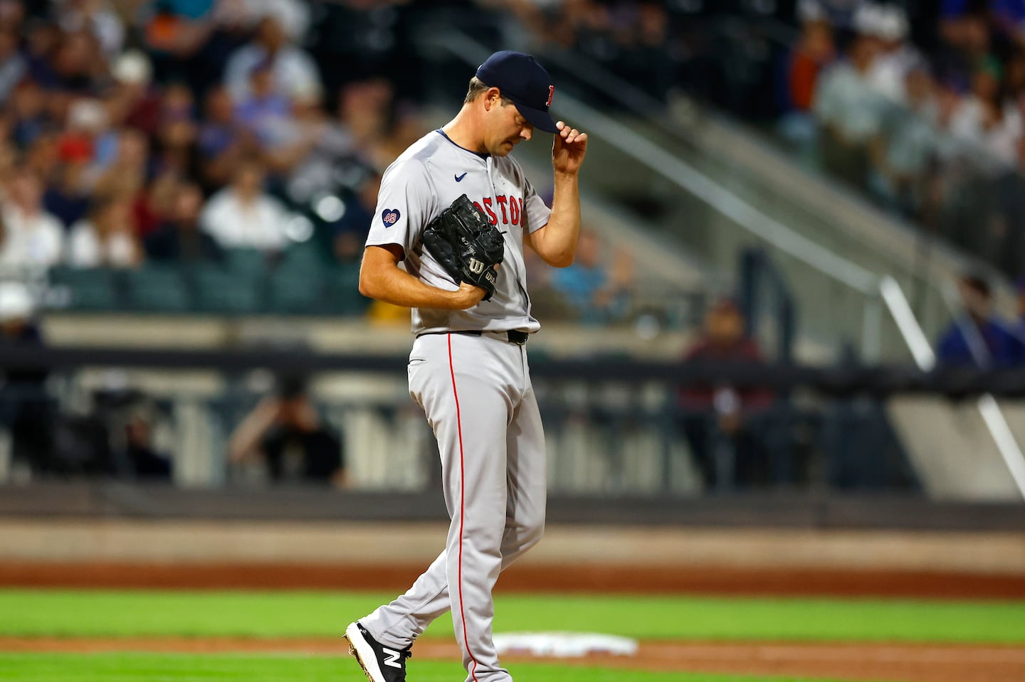 Red Sox reliever Rich Hill (above) reacts after walking in a run during the eighth inning of an 8-3 loss to the Mets Wednesday night at Citi Field.