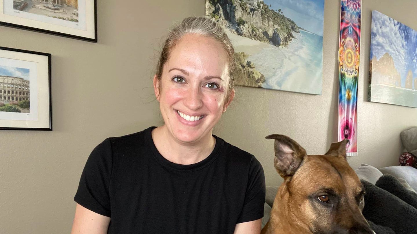 Lindsey Kee poses with her dog Teddy Ruffsavel at her home in Portland, Ore., on Aug. 3, 2024. Kee created an exercise routine around walking her dog,