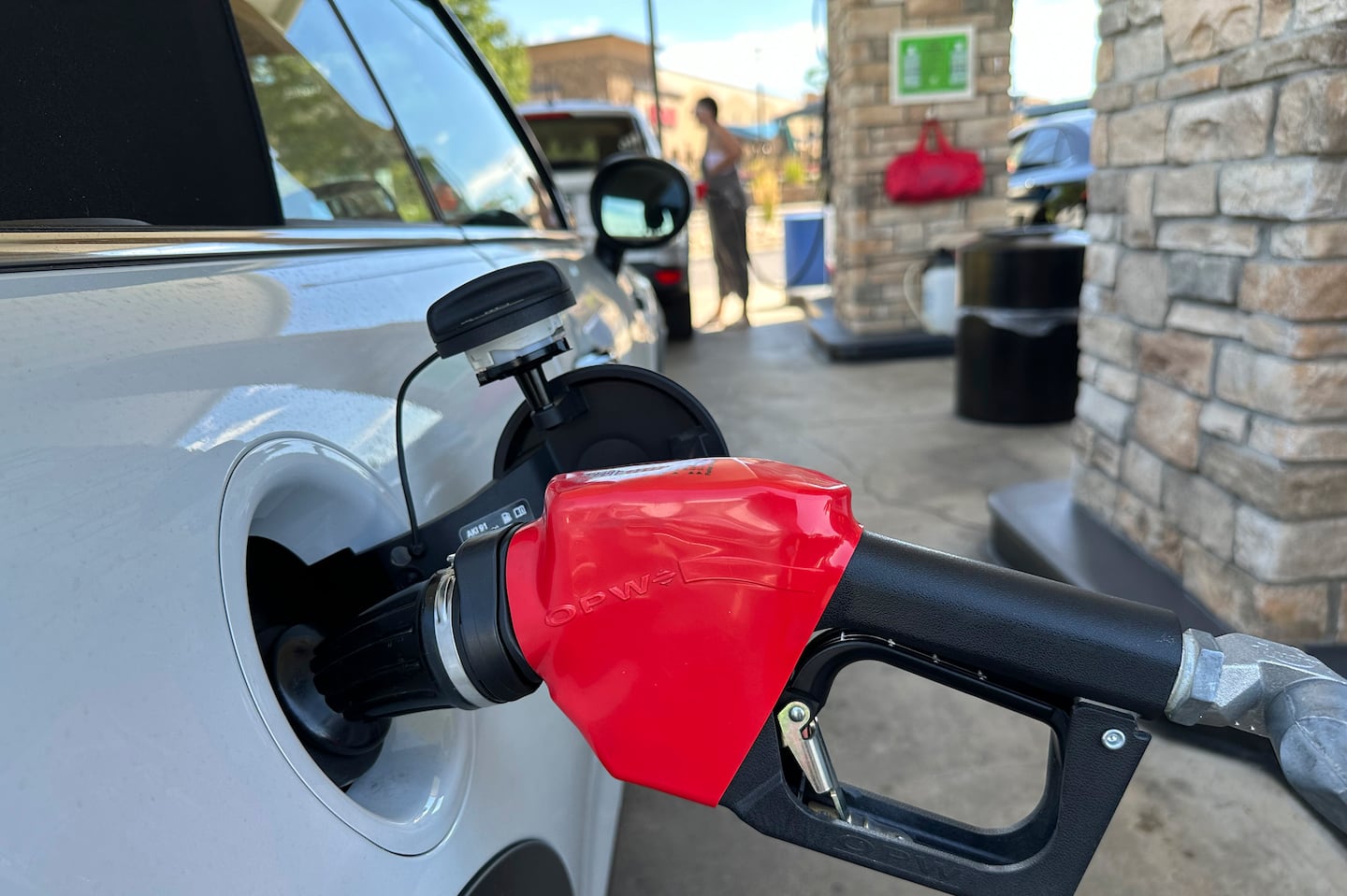 A motorist filled up the gasoline tank of a vehicle at a Costco warehouse on Aug. 22 in Parker, Colo.