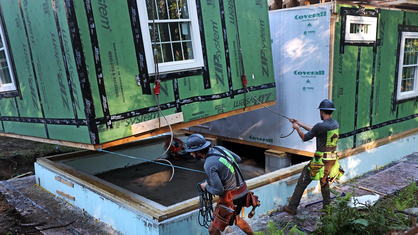 A constructed accessory dwelling unit was lowered by crane into a backyard in Concord on Sept. 12, 2023.