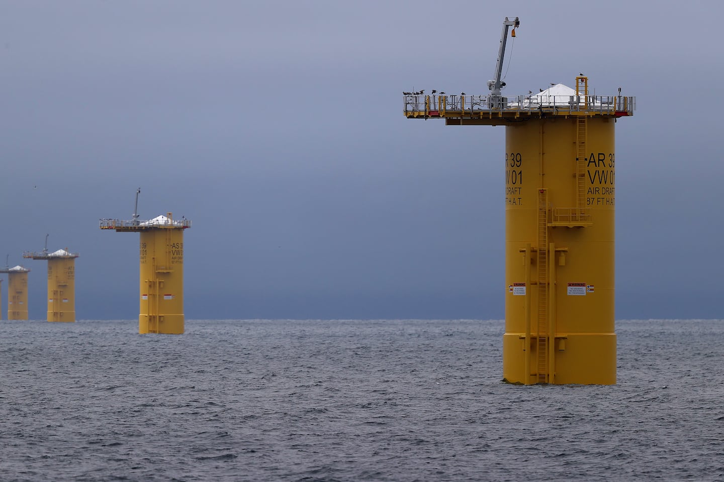 Pilings that serve as the base of offshore wind turbines in waters south of Martha's Vineyard last year. Contracts for the second wave of wind farms off the New England coast were awarded Friday.