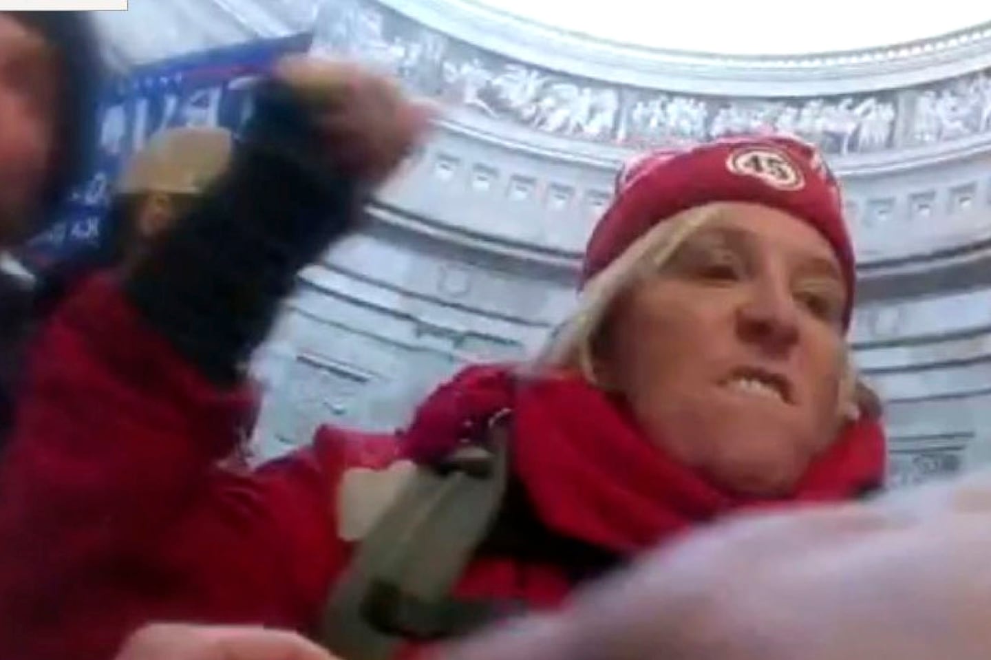 This image from U.S. Capitol Police body-worn video that was in the government sentencing memorandum in the case, shows  Dr. Jacquelyn Starer, 71, of Ashland, striking a police officer in the Rotunda of the U.S. Capitol on Jan. 6, 2021, in Washington.