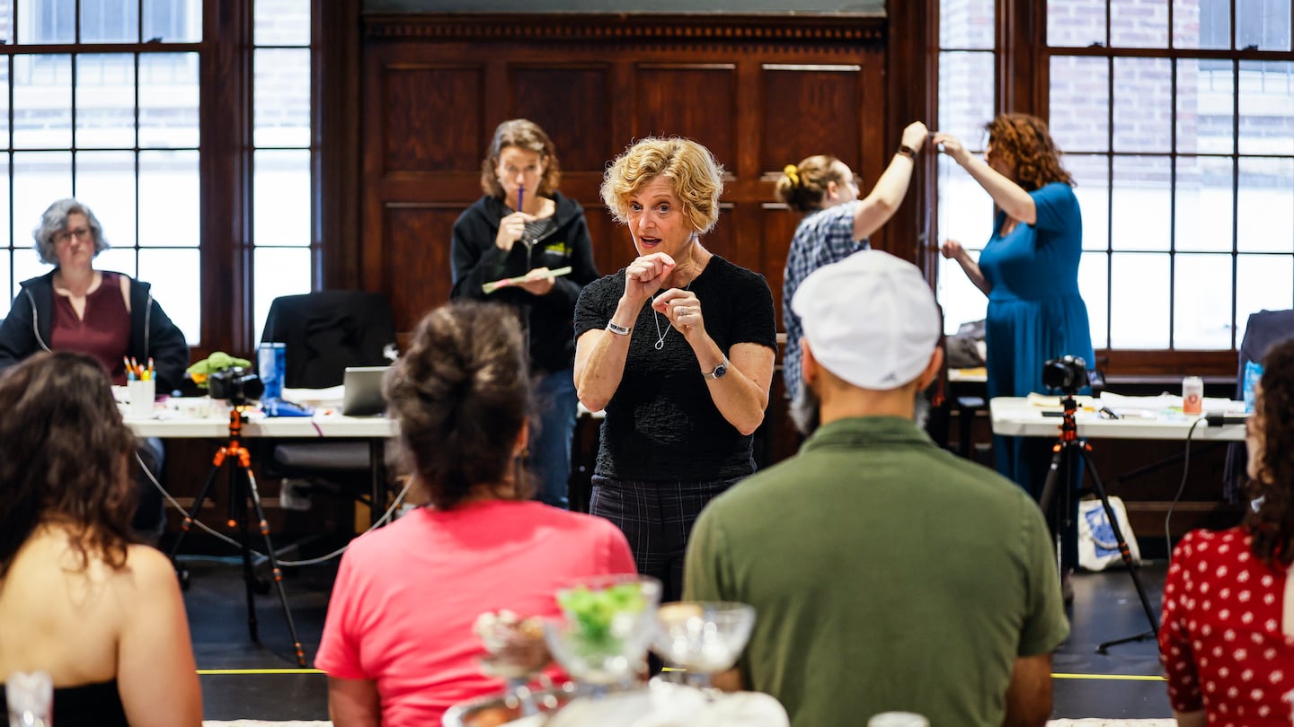 Director Carey Perloff speaks with the cast during rehearsal for the Huntington Theatre's production of Tom Stoppard's "Leopoldstadt."