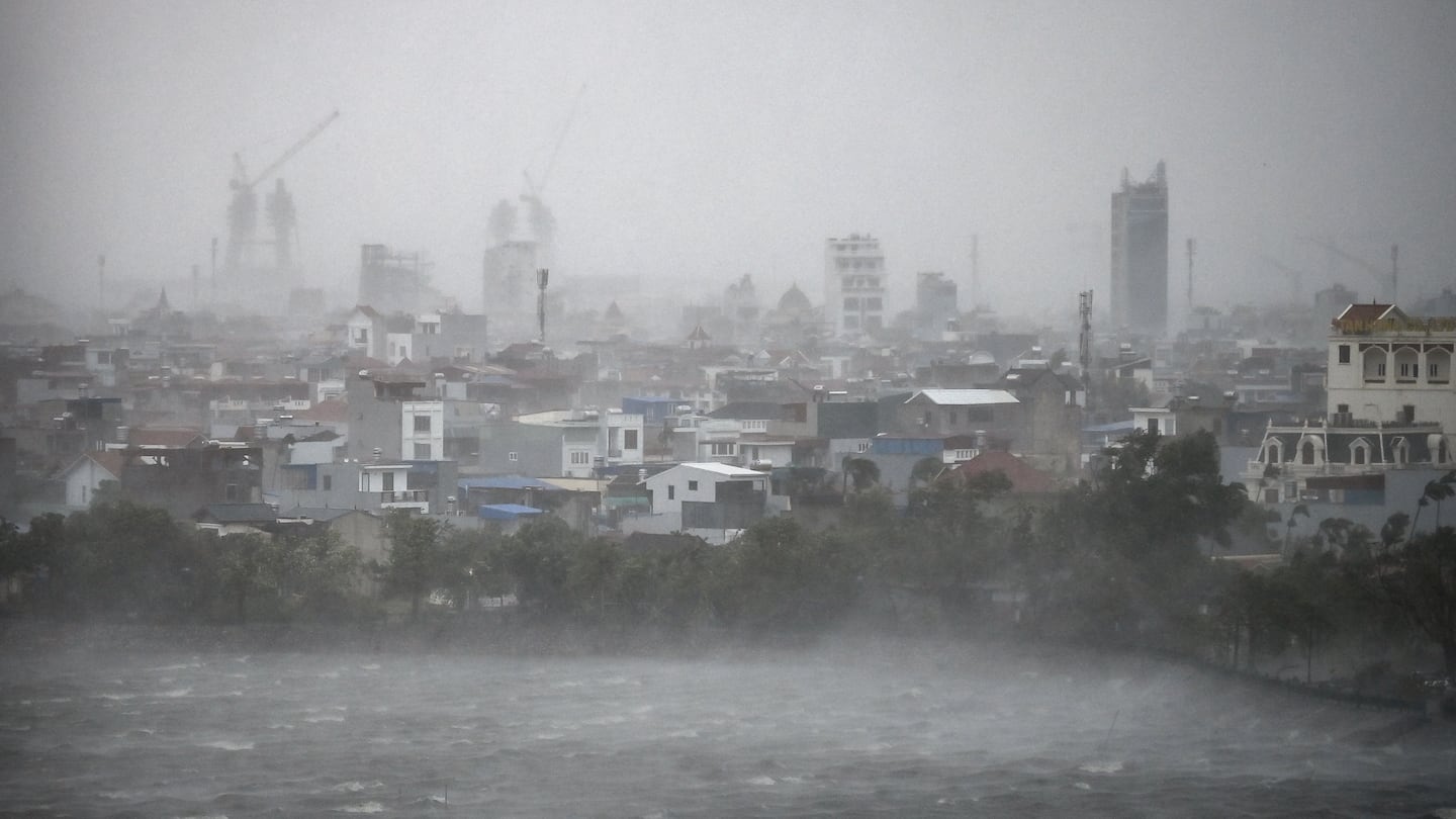 Water is whipped up by high winds onto the shore of Phuong Luu lake as Super Typhoon Yagi hits Hai Phong on Sept. 7.