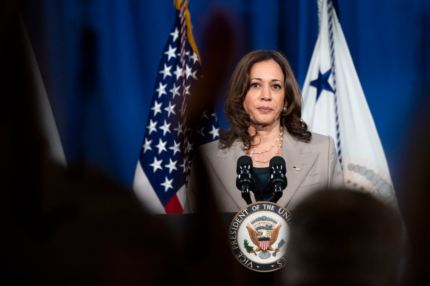 People applauded as Vice President Kamala Harris announced the cancelation of all federal student loans borrowed to attend any Corinthian College school on June 2, 2022.