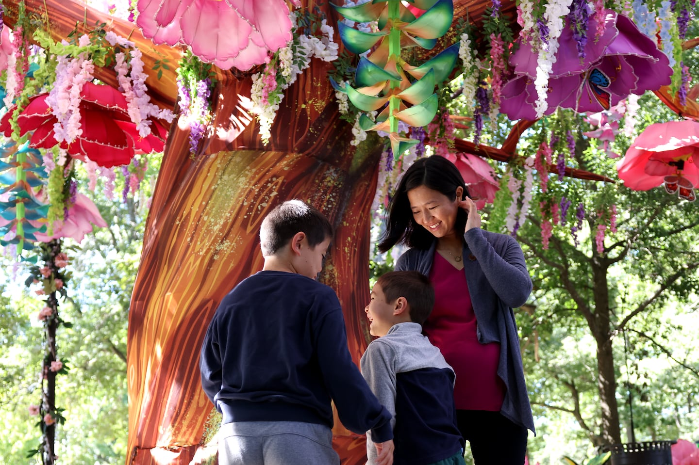 Mayor Michelle Wu laughed with sons Cass (center) and Blaise at the Franklin Park Zoo. The family was there to promote BPS Sundays.