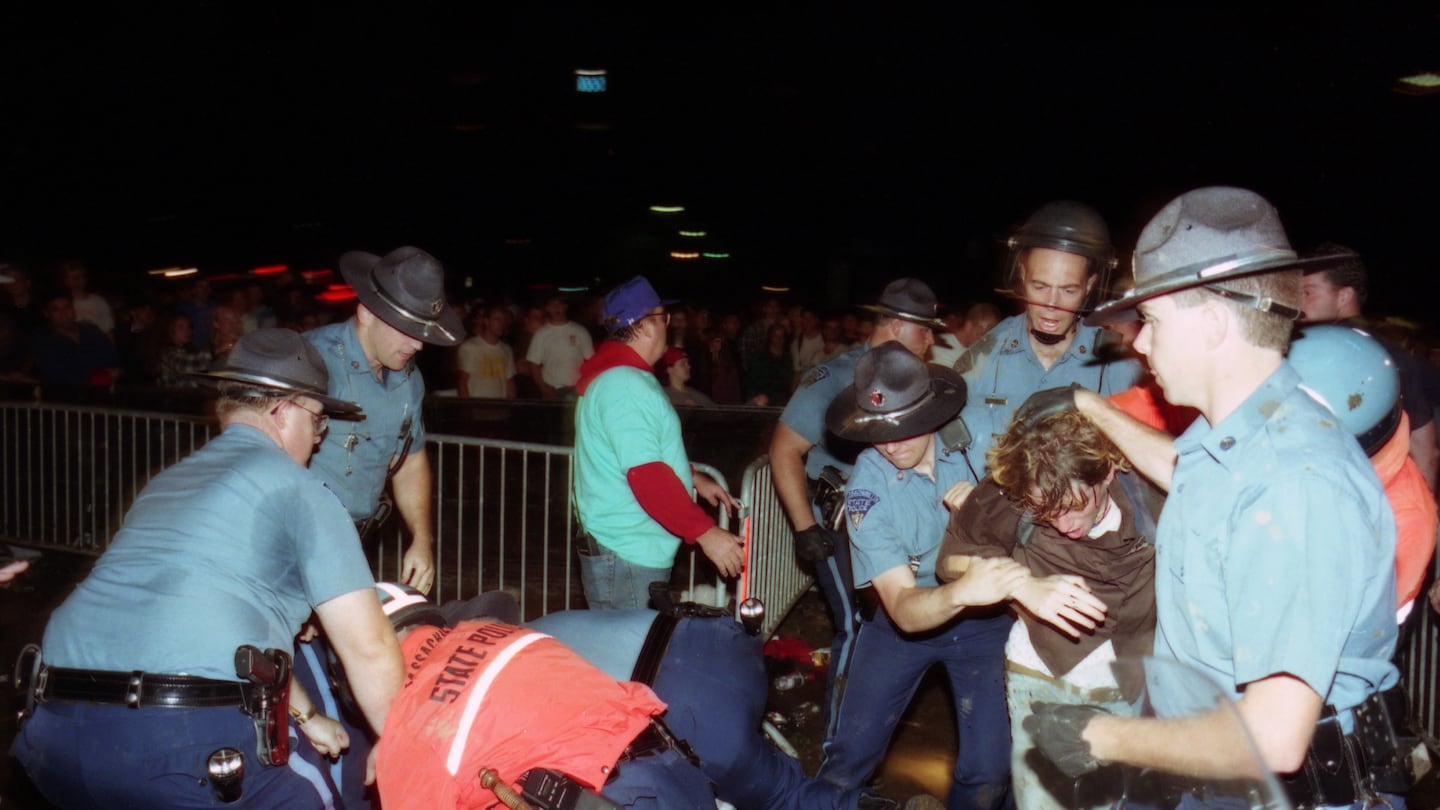 9/9/1994 Boston, MA - Massachusetts State Police arrest concert-goers after a riot interrupted a performance by Green Day at the Hatch Shell. (Lane Turner/Globe Staff)

BGPA - Riot - Music - Concert - Punk