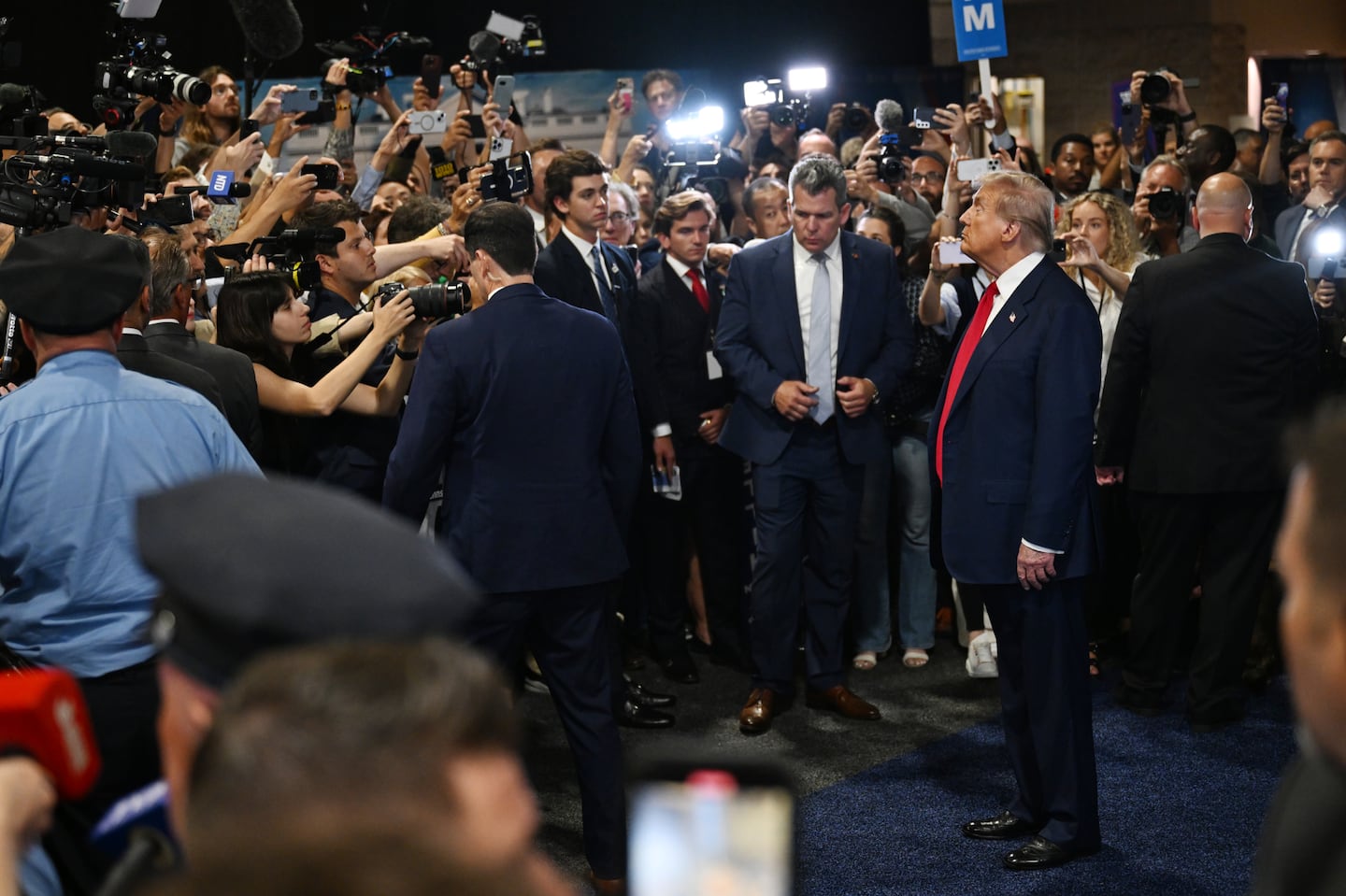 After his debate with Vice President Kamala Harris, former president Donald Trump makes an appearance in the spin room, where surrogates of both candidates engage with reporters, in Philadelphia, Sept. 10, 2024.