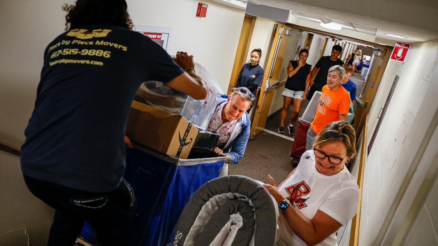 Families and students hauled belongings into the dorms at Boston College during move-in day in August.