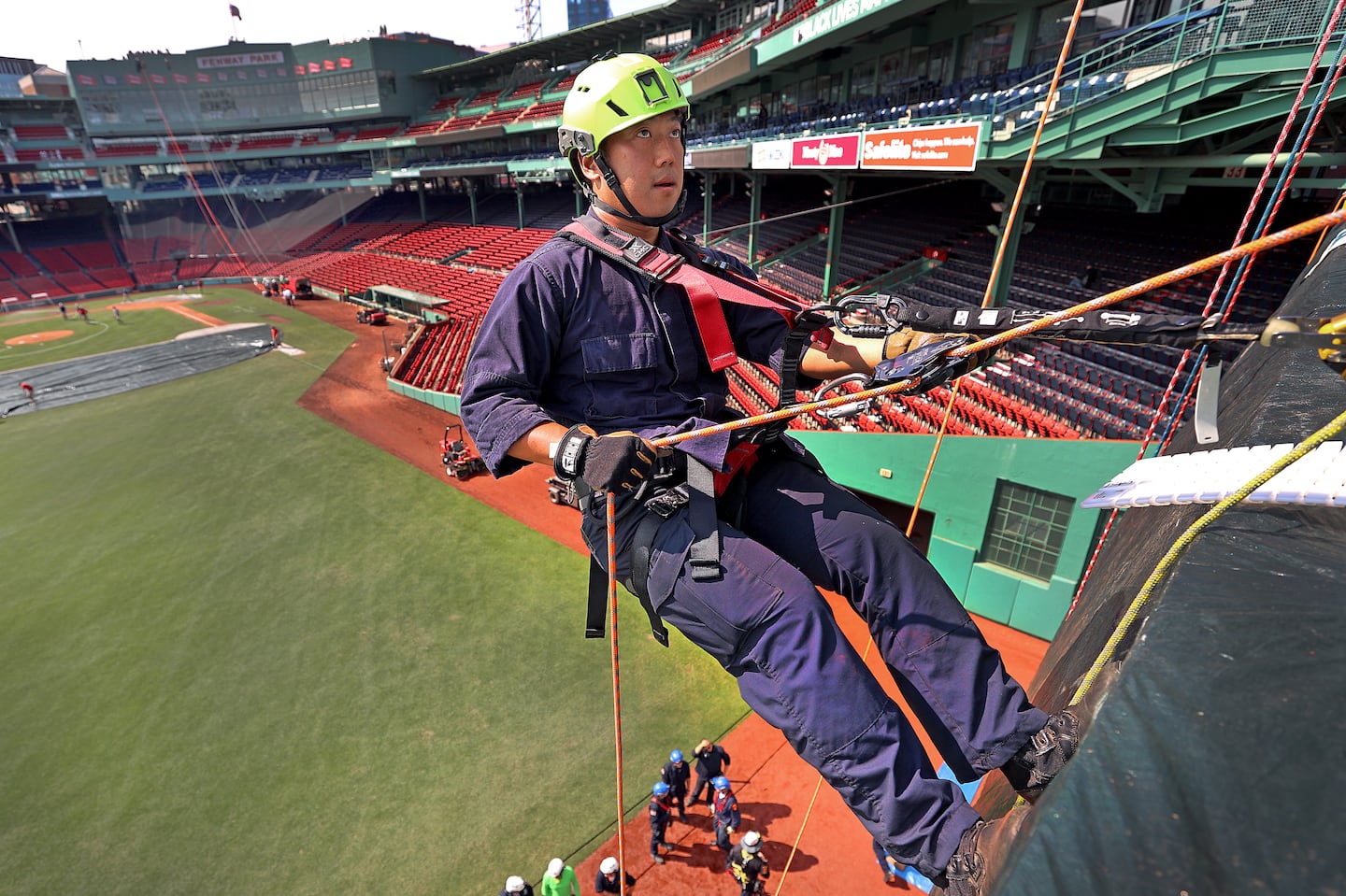 Reagan Li rappelled from the Green Monster during a joint training event for Massachusetts technical rescue teams at Fenway Park.  He is a firefighter with Boston's Engine 10.