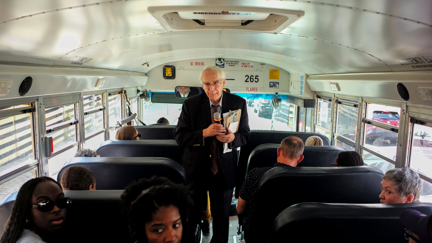 Lewis Finfer lead the tour that was taken to some sites on a school bus.