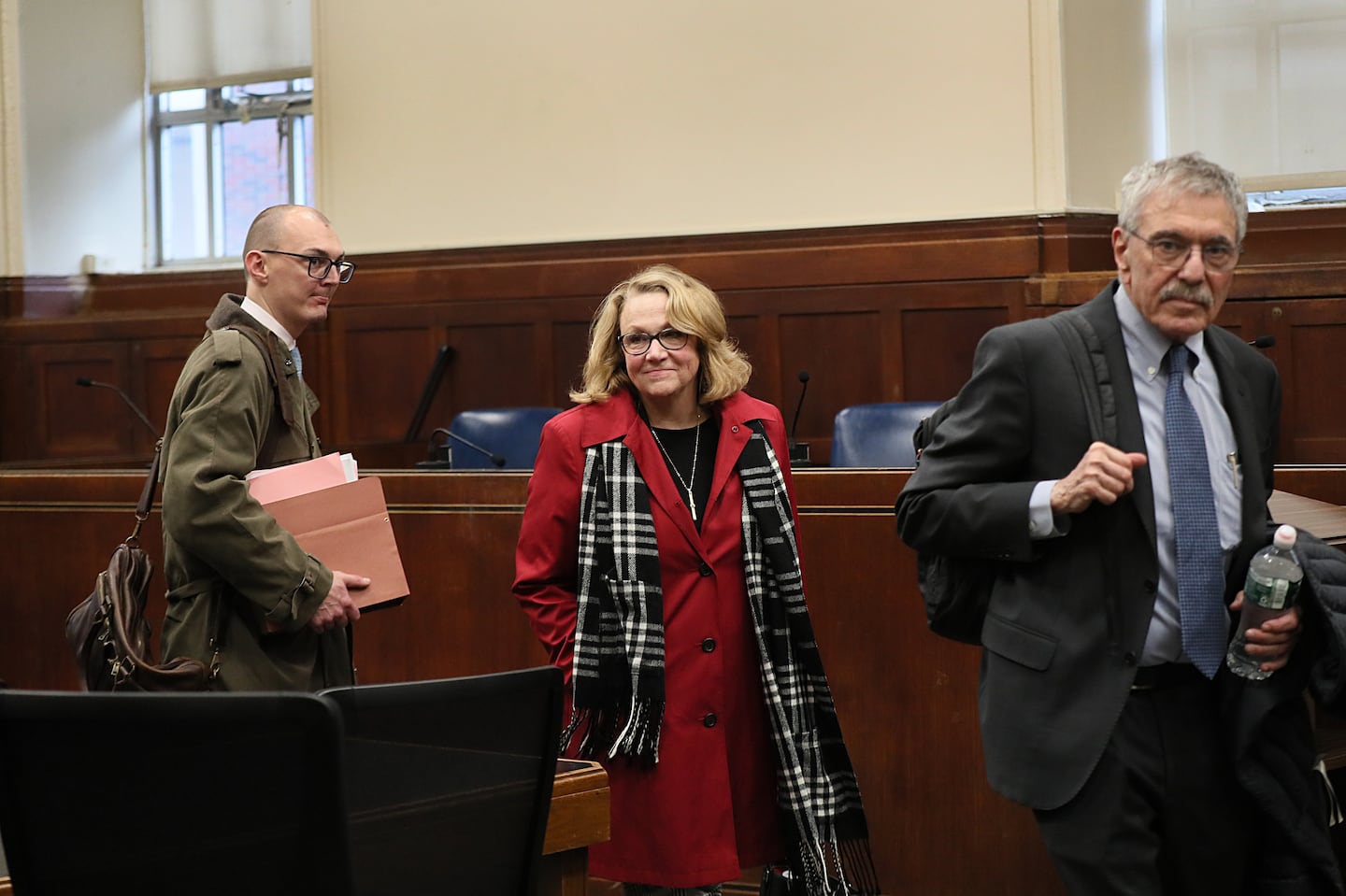 Shannon O'Brien, center, leaves Suffolk Superior Court with her attorneys following a December hearing.