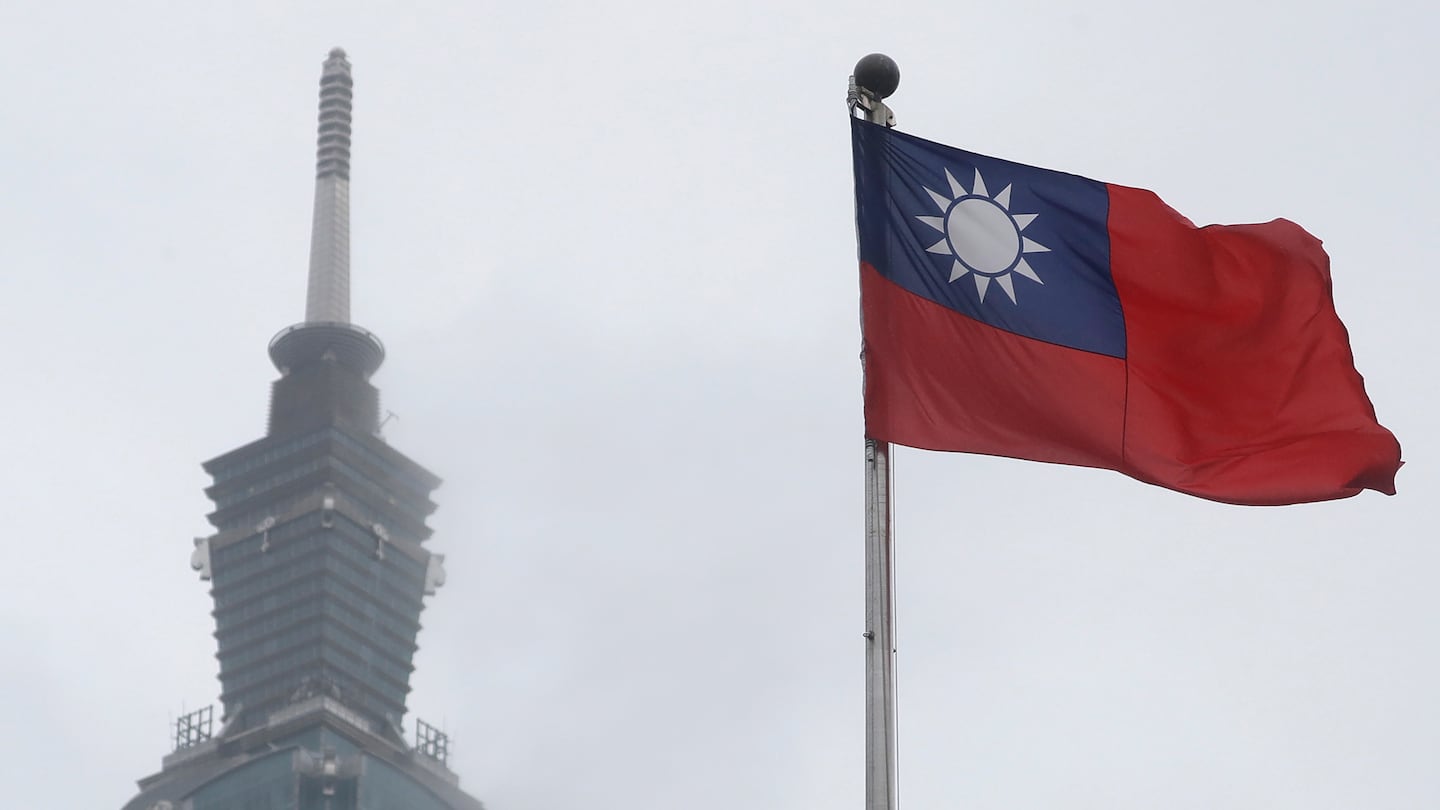 A Taiwan national flag flutters near the Taipei 101 building at the National Dr. Sun Yat-Sen Memorial Hall in Taipei, Taiwan, on May 7, 2023.