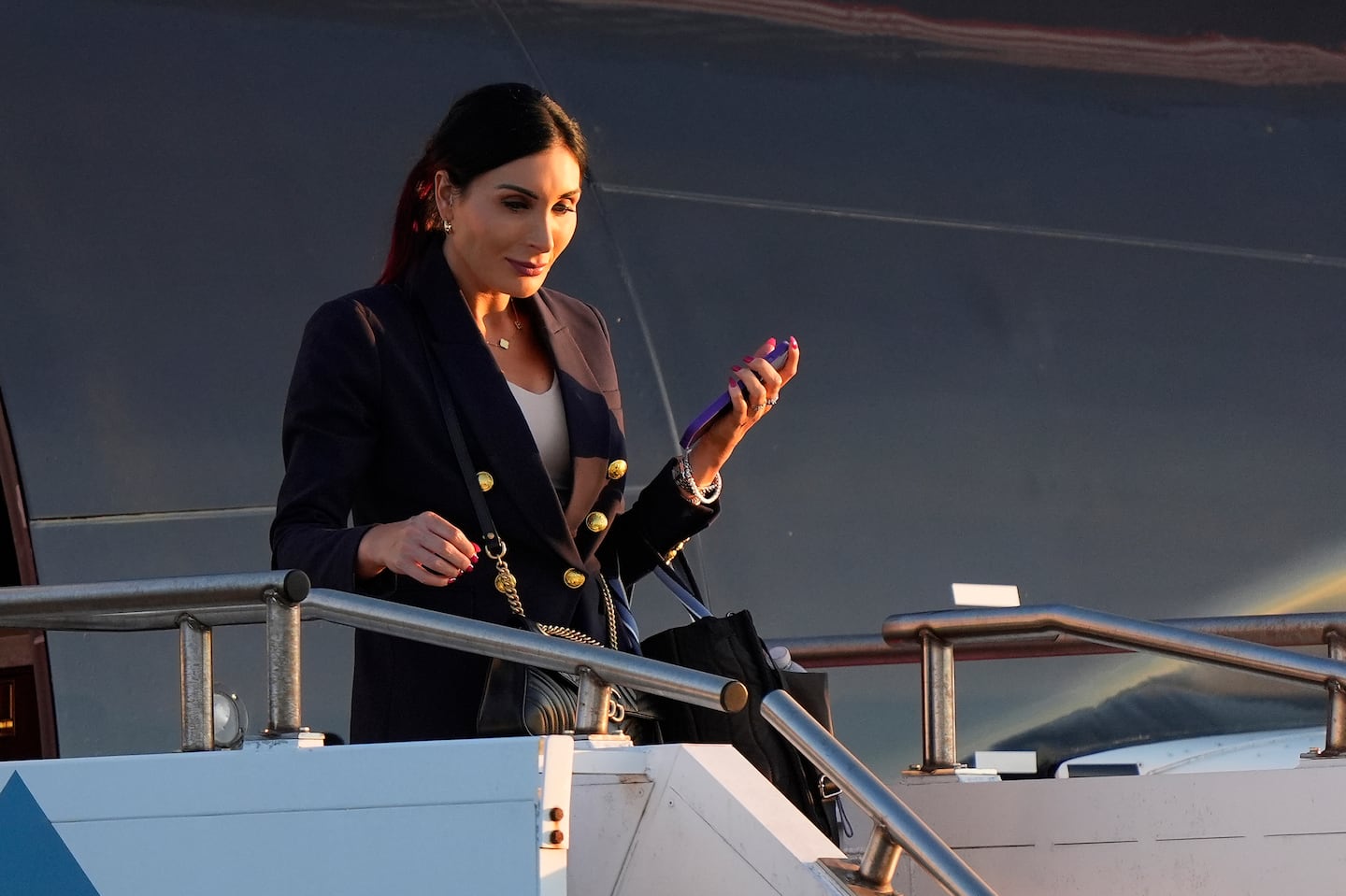 Laura Loomer arrives with Republican presidential nominee former President Donald Trump at Philadelphia International Airport, Tuesday, Sept. 10, 2024, in Philadelphia, for the presidential debate.