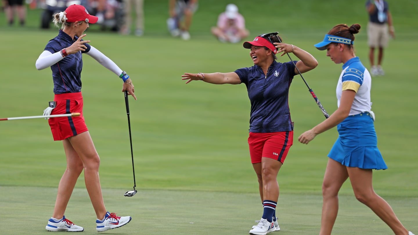 Rockland's Megan Khang (center) and Nelly Korda of Team United States react after winning their match, 6 and 4, against Europe's Georgia Hall (right) and Leona Maguire (not pictured) during the Friday afternoon fourball matches at the Solheim Cup at Robert Trent Jones Golf Club in Gainesville, Va.