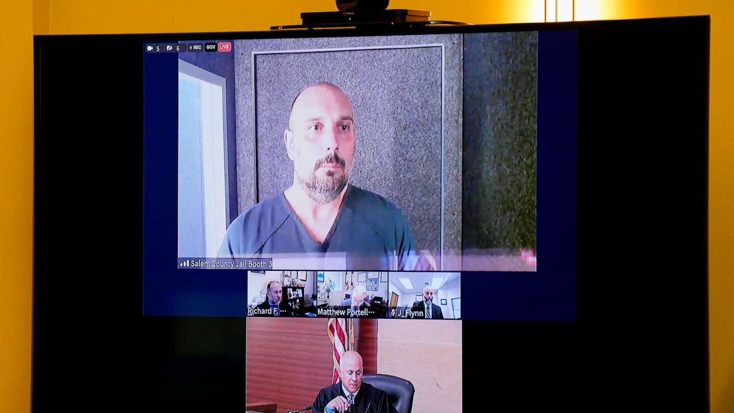 Sean M. Higgins, top, the alleged drunken driver charged with killing NHL hockey player Johnny Gaudreau and his brother Matthew as they bicycled on a rural road, appeared before Judge Michael Silvanio, bottom, for his hearing via video from jail on Friday in Woodbury, N.J.