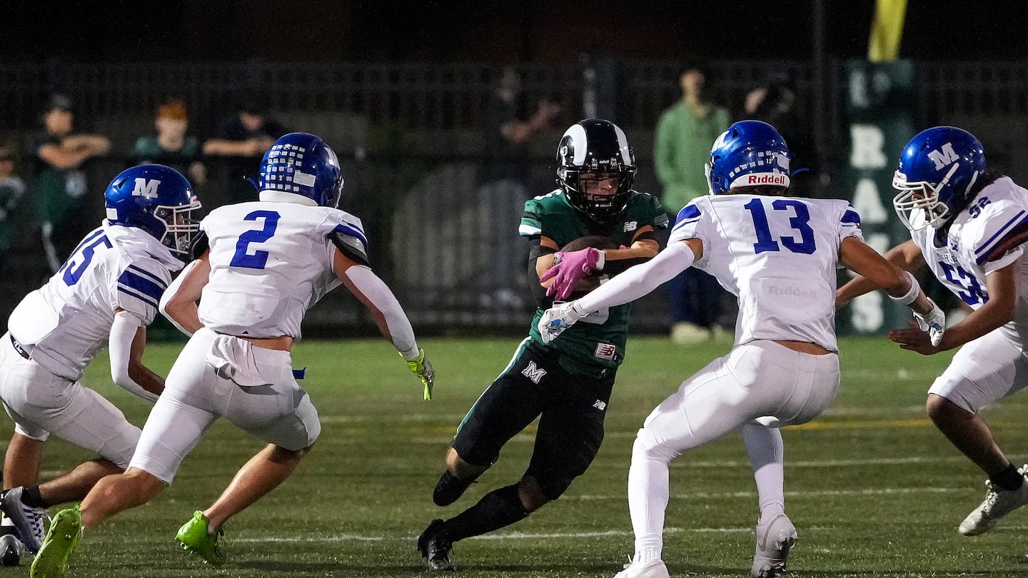 Marshfield’s Davin True (center) looks for an opening against Methuen’s defense on this run during the first half of a 31-23 comeback victory over the visiting Rangers.