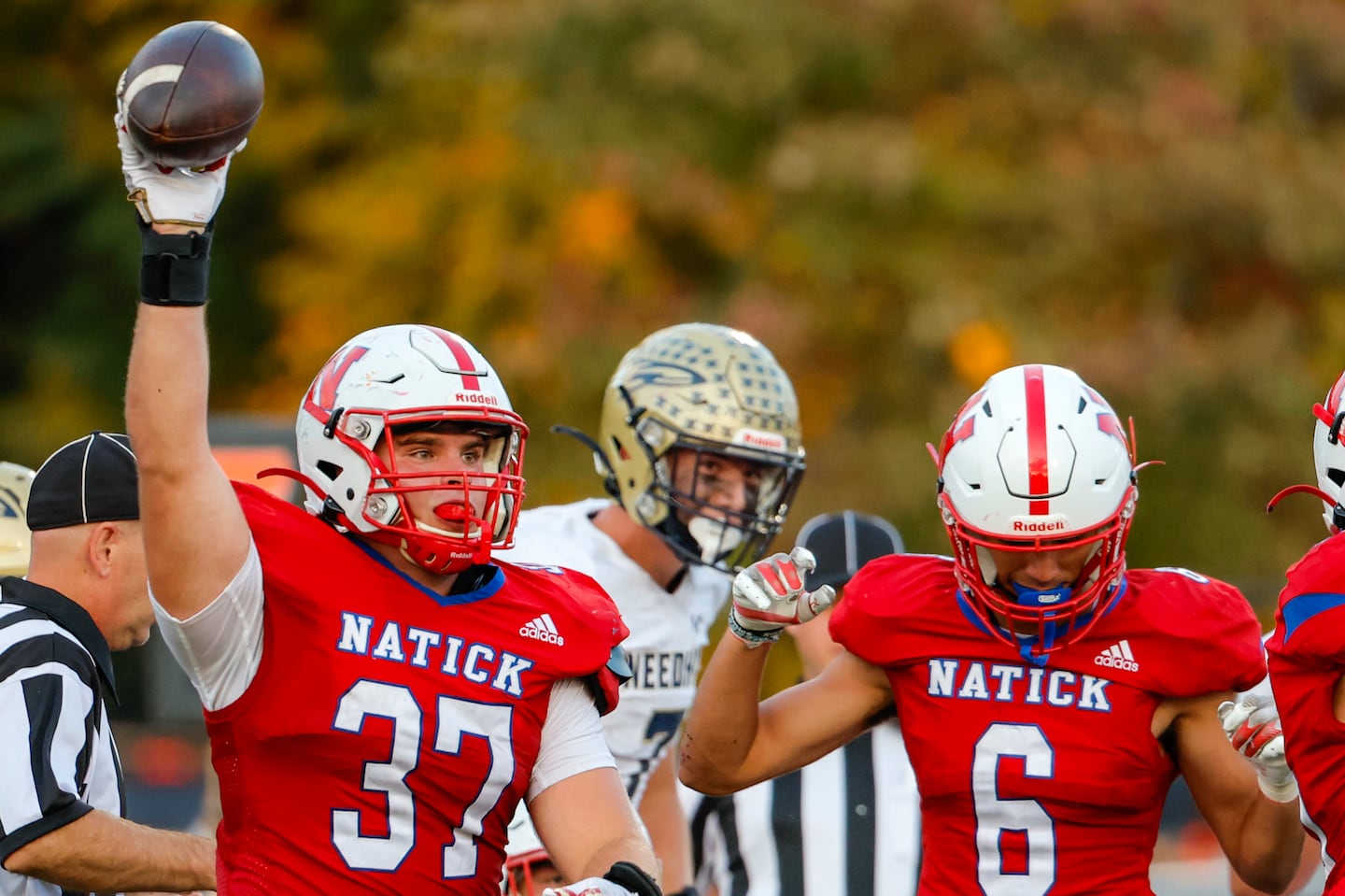 Natick's Jack Kelly recovers a fumble near the goal line against Needham on Friday.