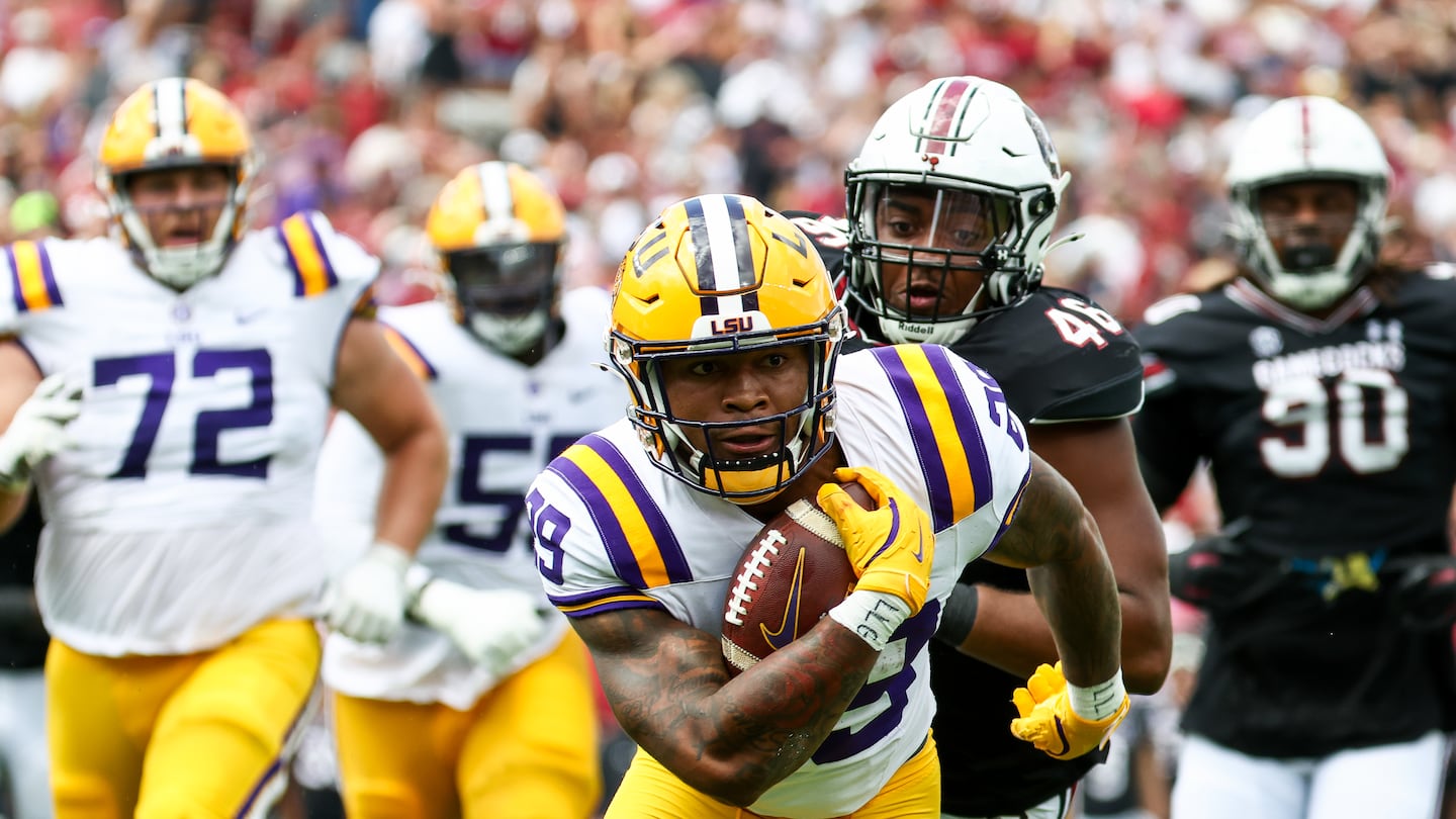 Caden Durham rushed for 98 yards and two touchdowns to help No. 16 LSU rally past South Carolina, 36-33, in the Tigers' SEC opener.