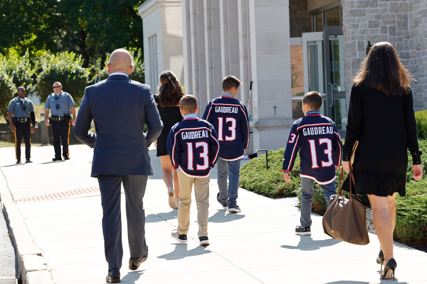 Young attendees wore Johnny Gaudreau Blue Jackets jerseys to the funeral services in Media, Pa., Sept. 9.