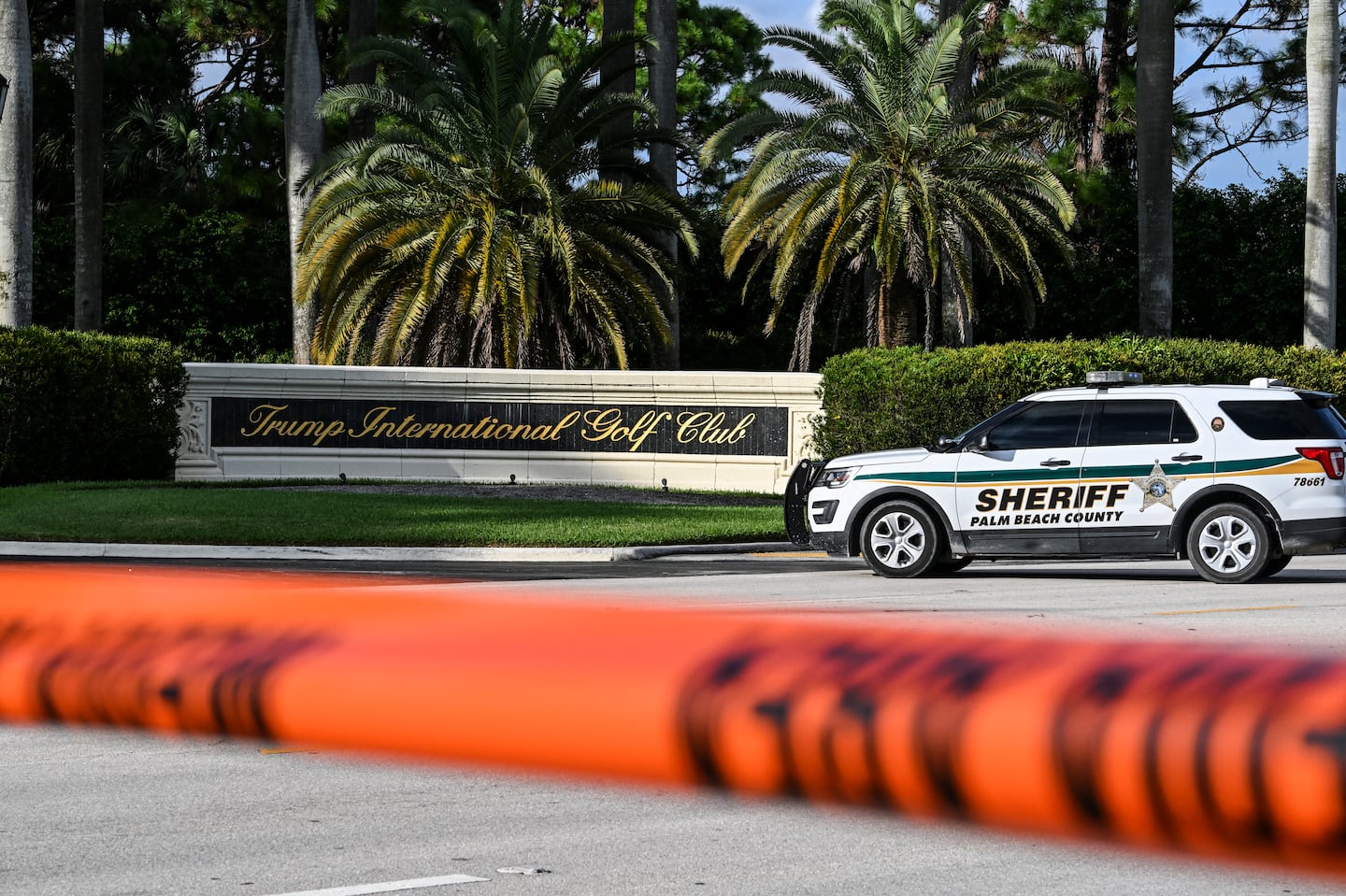 A sherrif blocked the street outside the Trump International Golf Club in West Palm Beach, Fla., on Sunday.