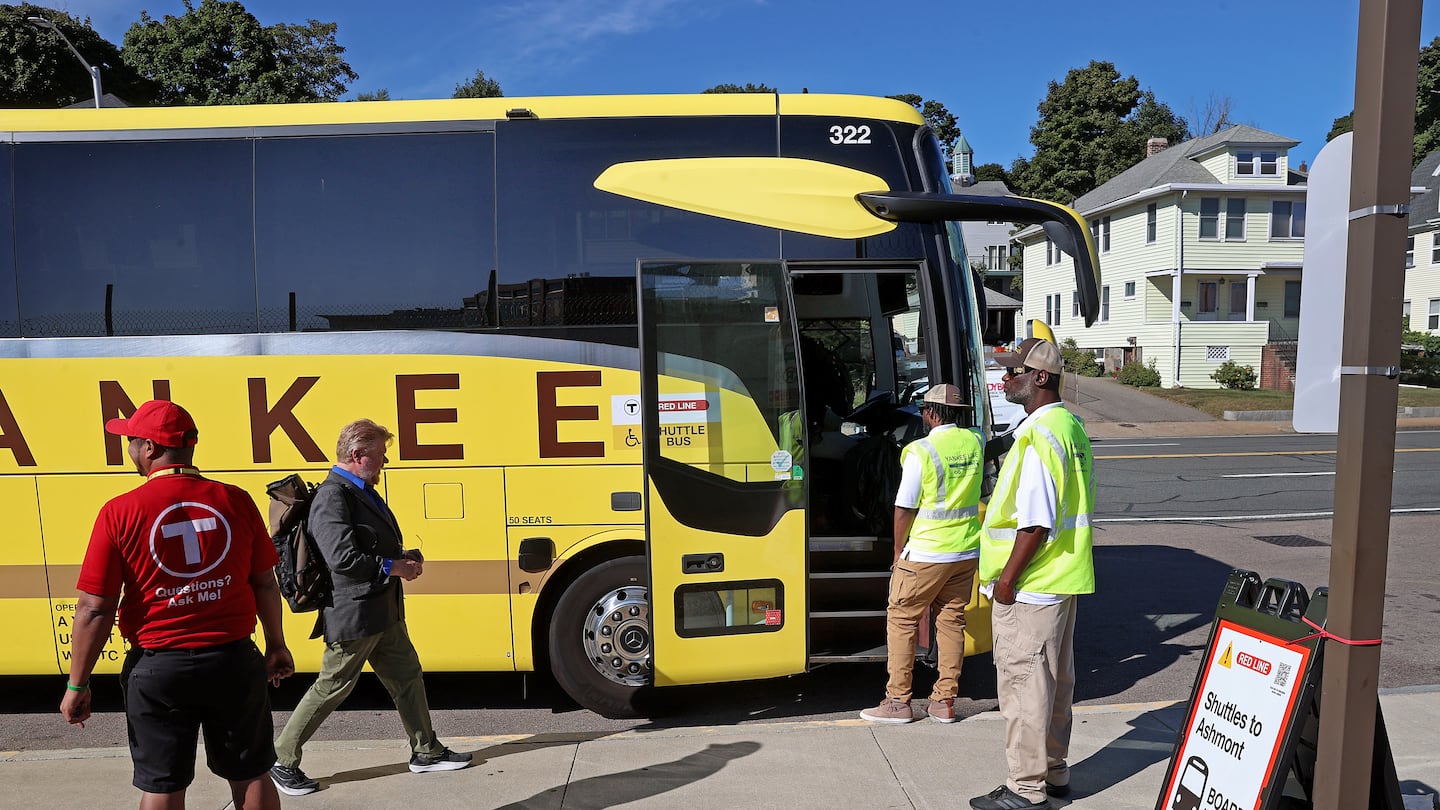 Commuters boarded buses outside the Quincy Center Station last week.