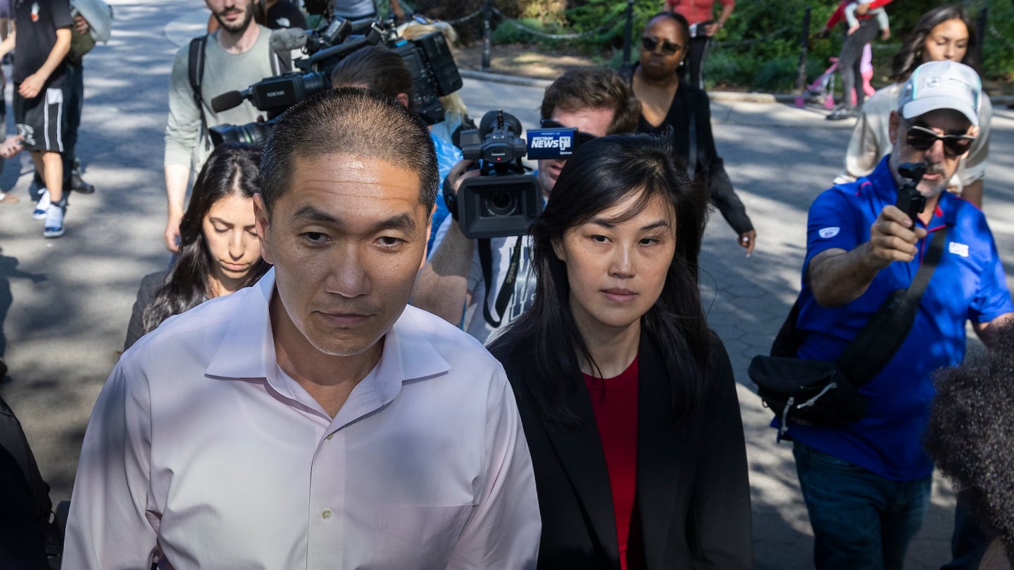 Former New York Governor Kathy Hochul aide Linda Sun and her husband, Christopher Hu, not in photo, leave Brooklyn Federal Court after their arraignment on Tuesday in New York. Sun was charged with acting as an illegal agent of the Chinese government. Prosecutors say she used her state positions to advance Beijing's agenda in exchange for financial benefits worth millions of dollars.