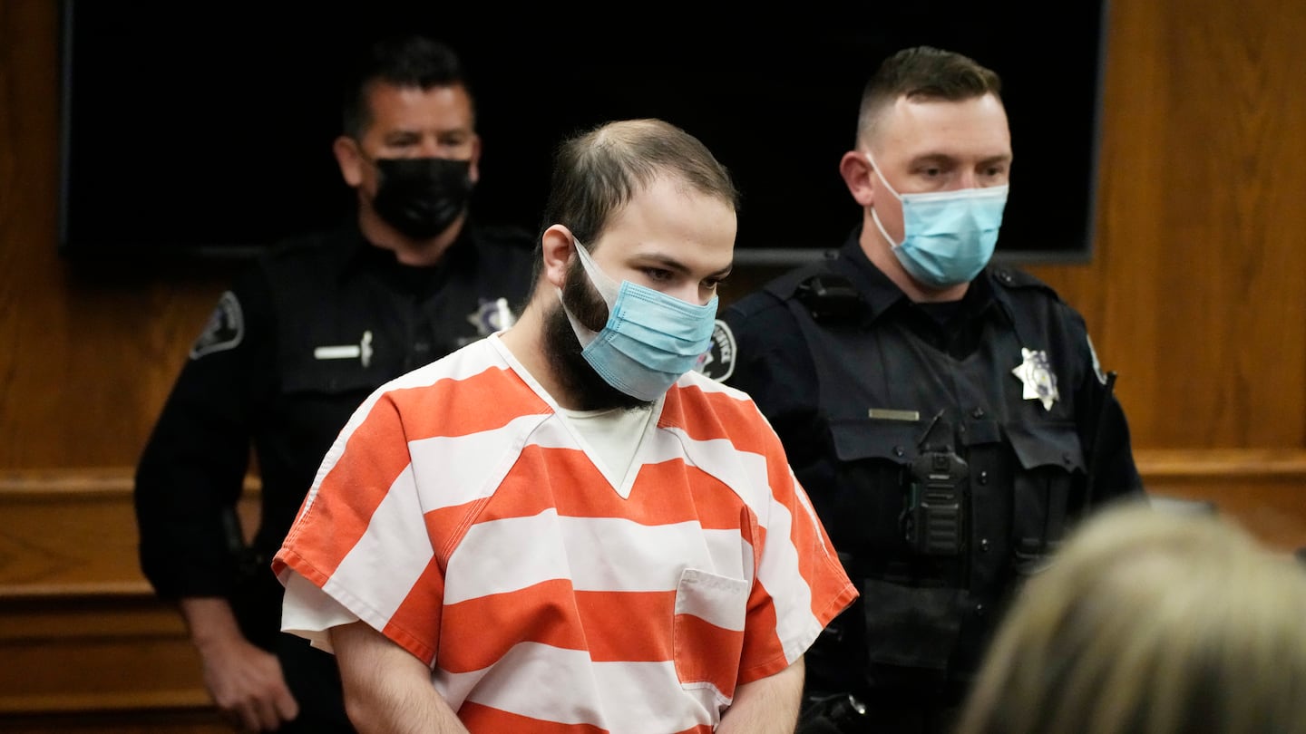 Ahmad Al Aliwi Alissa, accused of killing 10 people at a Colorado supermarket in March 2021, is led into a courtroom for a hearing, Sept. 7, 2021, in Boulder, Colo.