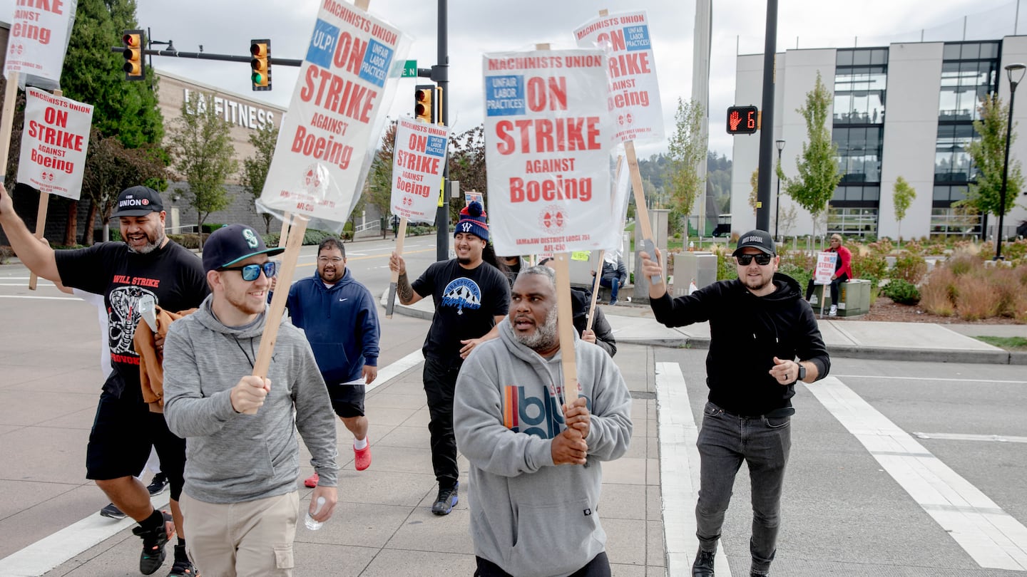 Striking Boeing workers and their supporters picketed outside the Boeing Co. manufacturing facility in Renton, Wash., on Monday.