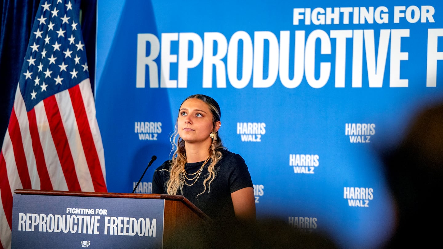 Hadley Duvall, a sexual assault survivor and reproductive rights advocate who spoke at the Democratic National Convention, joins a rally for Vice President Harris at the Independence Visitor Center in Philadelphia, Sunday, Sept. 15, 2024. Gov. Josh Shapiro headlined the reproductive rights rally before the campaign's national "Fighting for Reproductive Freedom" bus departed on a tour across Pennsylvania. (Tom Gralish/The Philadelphia Inquirer via AP)